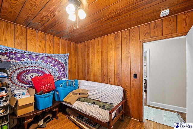 600 Greenway Dr, Florence, SC 29501 - bedroom featuring wood walls, wood ceiling, a ceiling fan, and wood finished floors