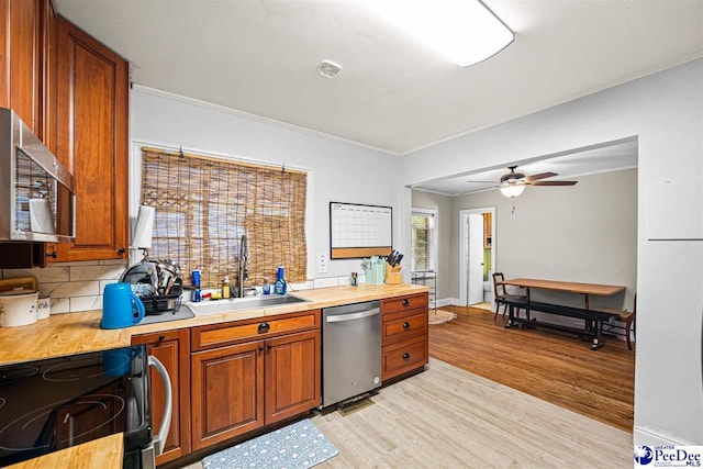 600 Greenway Dr, Florence, SC 29501 - kitchen with a sink, stainless steel appliances, light wood finished floors, and light countertops