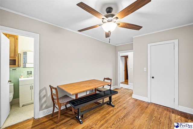 600 Greenway Dr, Florence, SC 29501 - dining space with light wood finished floors, crown molding, and a ceiling fan