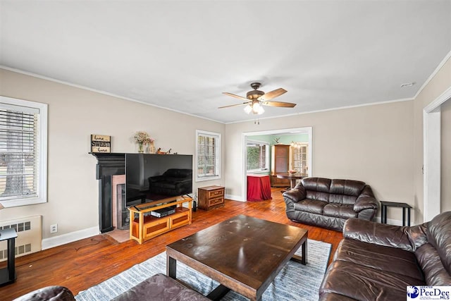 600 Greenway Dr, Florence, SC 29501 - living room with a ceiling fan, wood finished floors, baseboards, and ornamental molding