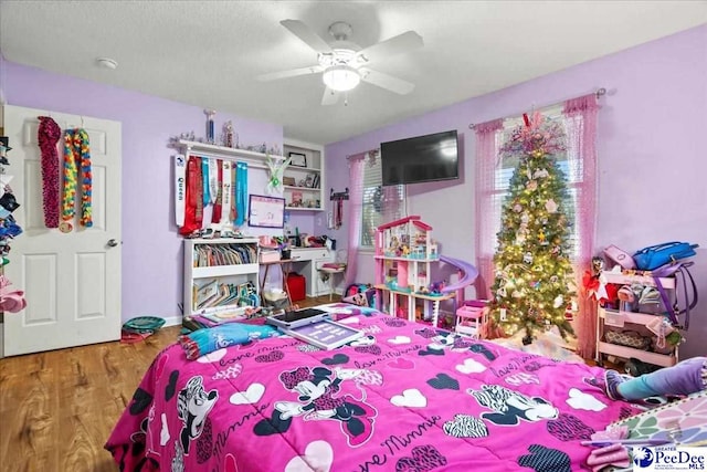 bedroom with hardwood / wood-style flooring and ceiling fan