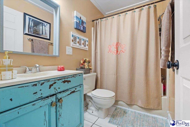 full bathroom featuring shower / bath combo with shower curtain, tile patterned floors, toilet, and vanity