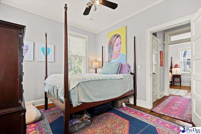 318 Mcleod St, Florence, SC 29501 - bedroom with wood finished floors, crown molding, and ceiling fan