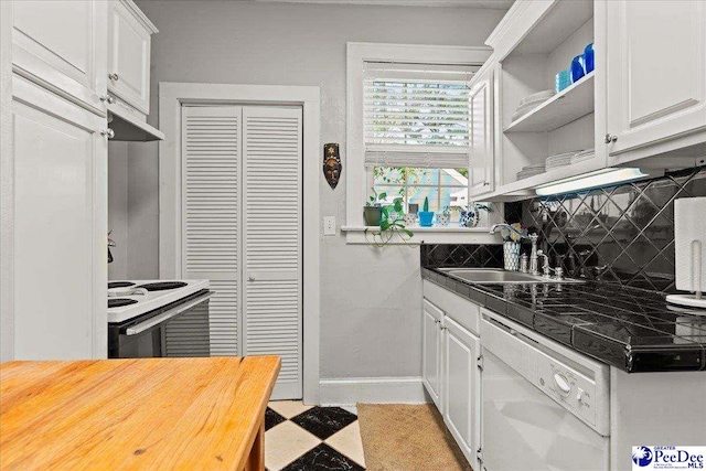 318 Mcleod St, Florence, SC 29501 - kitchen with white appliances, white cabinetry, backsplash, open shelves, and wood counters