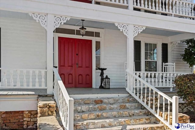 doorway to property featuring a porch