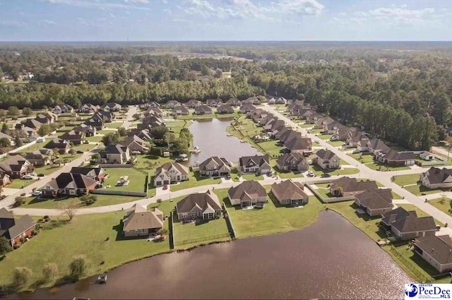 716 Lindsey Dr, Florence, SC 29501 - aerial overview of property's location with nearby suburban area, a nearby body of water, and a heavily wooded area
