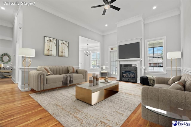 716 Lindsey Dr, Florence, SC 29501 - living room featuring crown molding, light wood-type flooring, ceiling fan, healthy amount of natural light, and recessed lighting