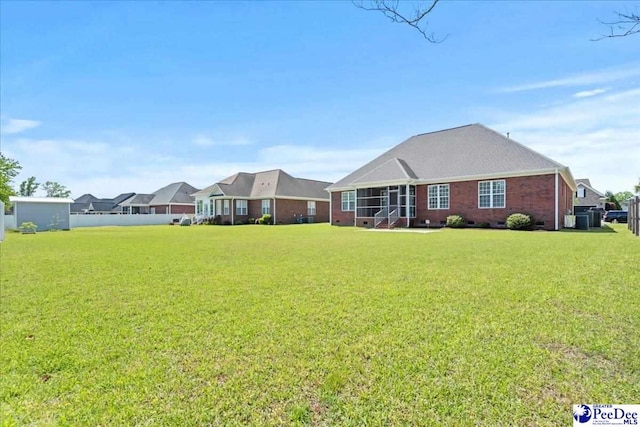 716 Lindsey Dr, Florence, SC 29501 - view of front of house featuring a front lawn and brick siding