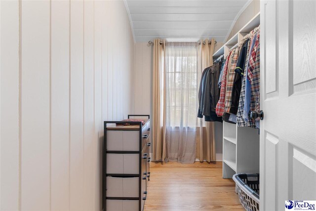 walk in closet featuring wood finished floors