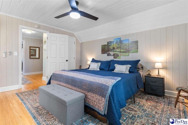 bedroom with wood finished floors, baseboards, and ceiling fan