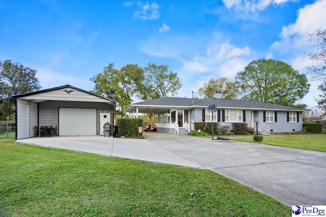 ranch-style home featuring a garage and a front yard