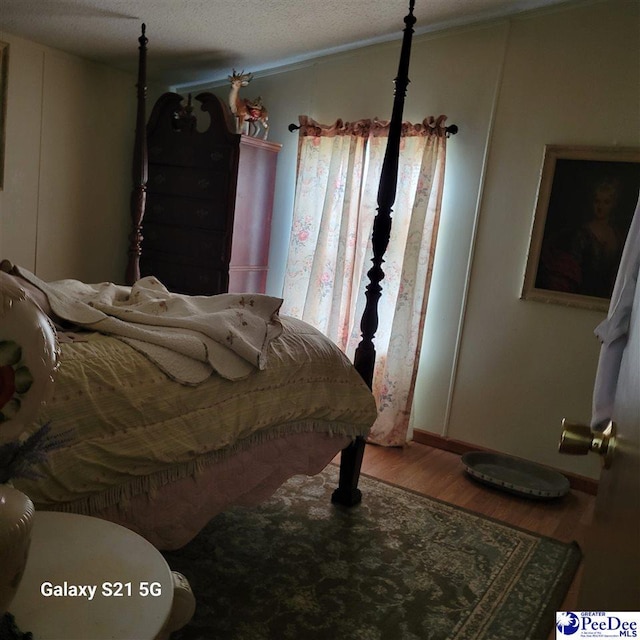 2378 Nichols Ln 2374, 2376, Effingham, SC 29541 - bedroom with a textured ceiling and wood finished floors