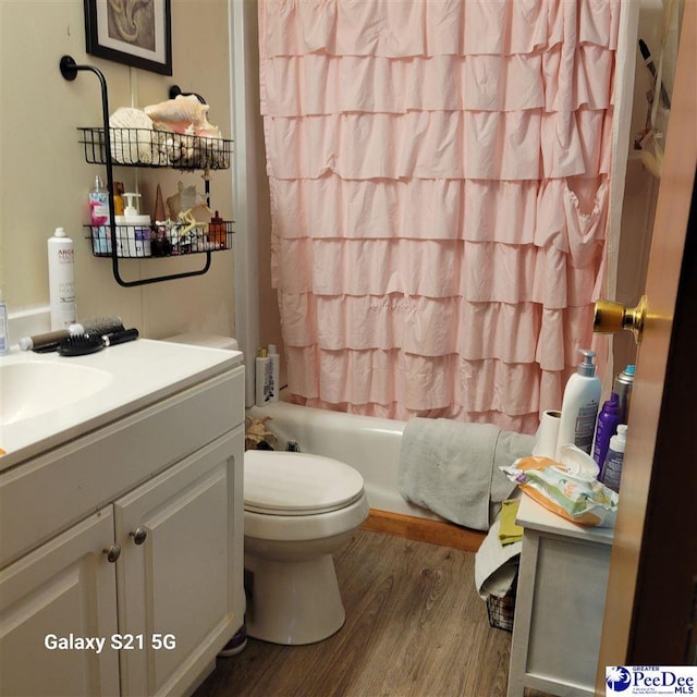 2378 Nichols Ln 2374, 2376, Effingham, SC 29541 - full bathroom featuring toilet, vanity, shower / tub combo with curtain, and wood finished floors
