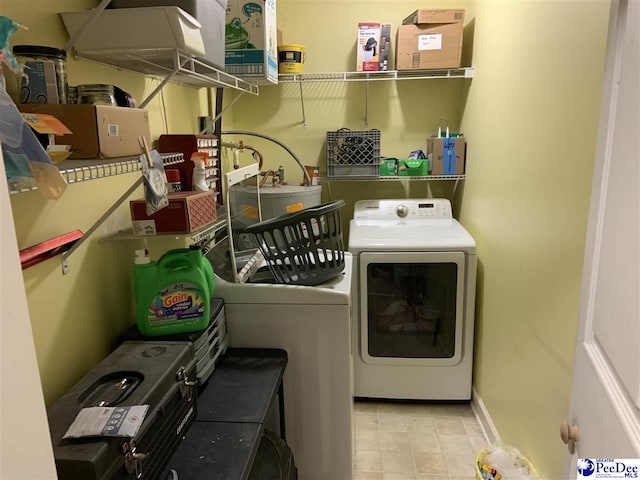 washroom featuring washer and clothes dryer