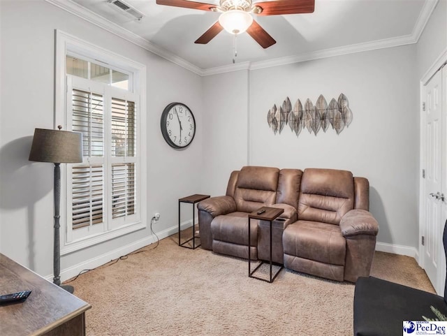 living room with crown molding, light colored carpet, and ceiling fan