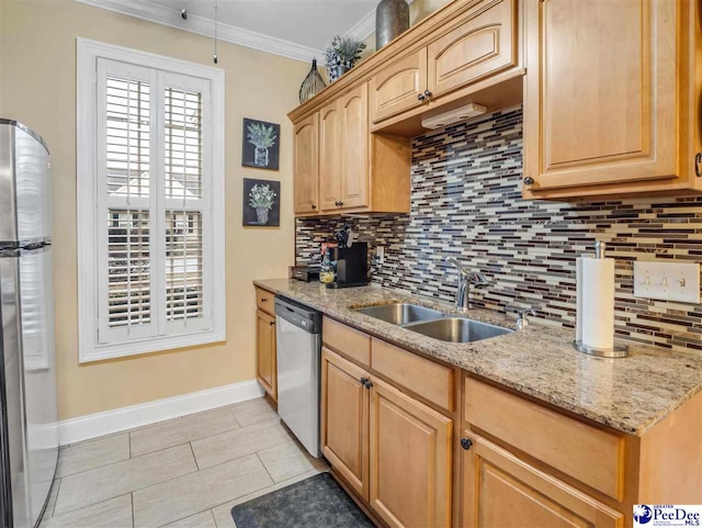 kitchen featuring sink, light stone counters, tasteful backsplash, ornamental molding, and stainless steel appliances