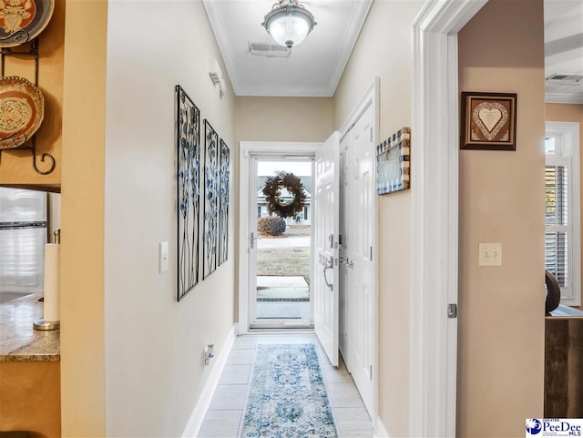 entryway featuring crown molding and light tile patterned flooring