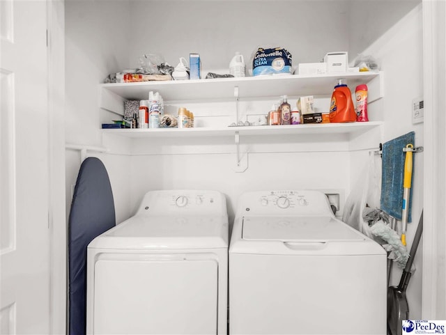 laundry room featuring washing machine and dryer