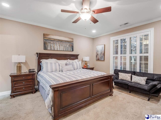 bedroom with light carpet, ornamental molding, and ceiling fan