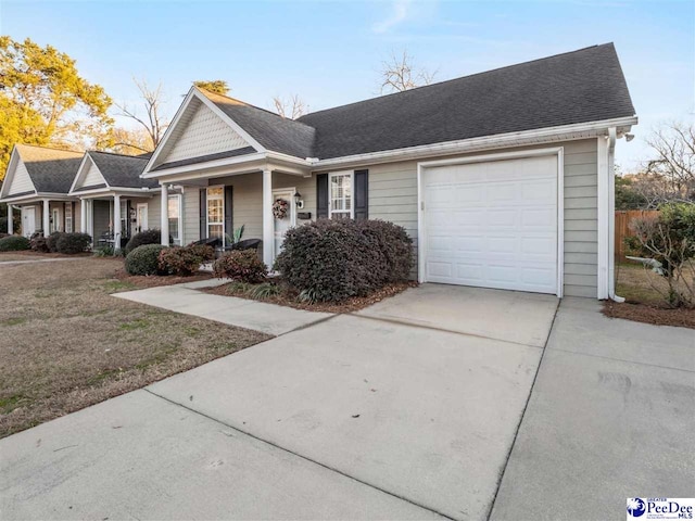 view of front of home with a garage and covered porch