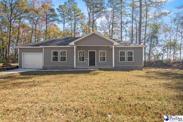 ranch-style house featuring a garage, a front yard, and a porch