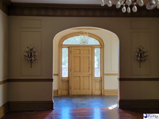 601 Cashua St, Darlington, SC 29532 - foyer entrance with arched walkways, baseboards, and wood finished floors