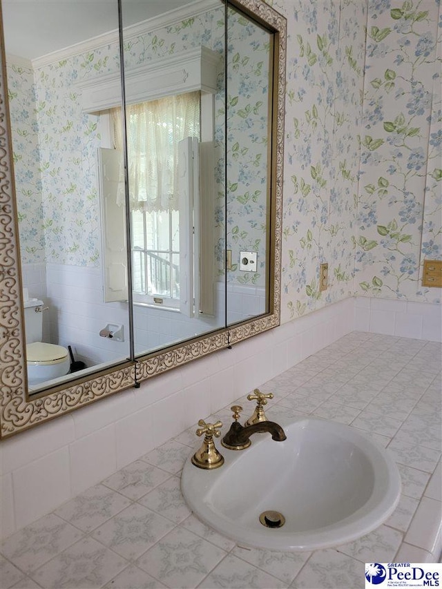 601 Cashua St, Darlington, SC 29532 - bathroom with wallpapered walls, a sink, toilet, ornamental molding, and a wainscoted wall
