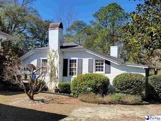 601 Cashua St, Darlington, SC 29532 - view of side of property with a chimney