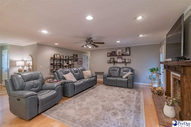 100 Warren Way, Cheraw, SC 29520 - living area featuring a textured ceiling, light wood finished floors, a ceiling fan, crown molding, and recessed lighting