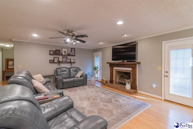 100 Warren Way, Cheraw, SC 29520 - living room with a textured ceiling, wood finished floors, ceiling fan, recessed lighting, and a brick fireplace