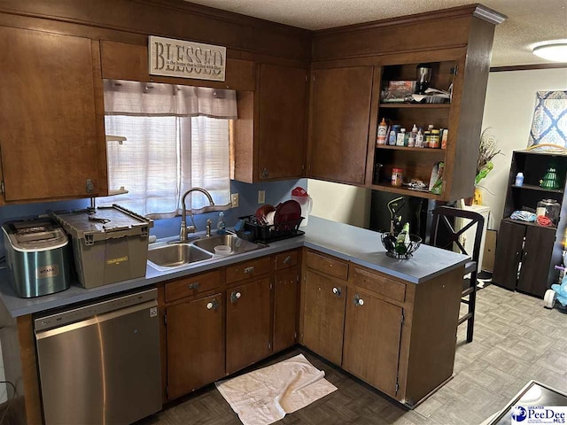 kitchen featuring crown molding, a peninsula, a textured ceiling, a sink, and dishwasher