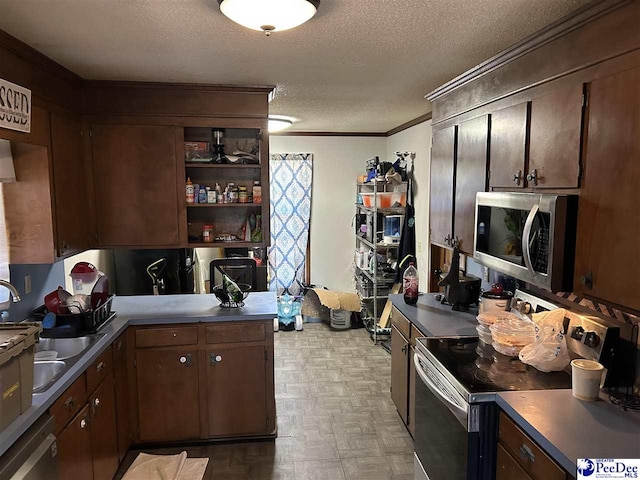463 Chippenham Ln, Florence, SC 29501 - kitchen with stainless steel appliances, ornamental molding, a textured ceiling, dark countertops, and dark brown cabinets
