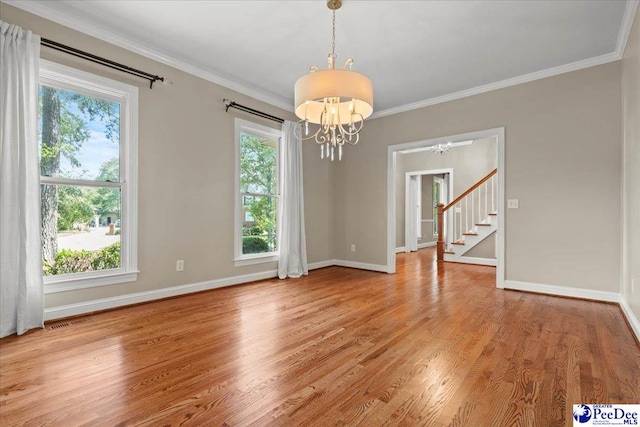 3427 Sussex Ct, Florence, SC 29501 - unfurnished room with a chandelier, stairs, light wood finished floors, and crown molding