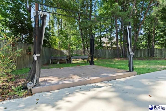 3427 Sussex Ct, Florence, SC 29501 - fenced backyard with a patio area