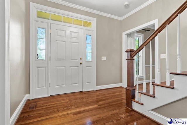 3427 Sussex Ct, Florence, SC 29501 - foyer entrance featuring stairway, wood finished floors, crown molding, and healthy amount of natural light