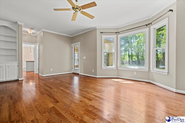 3427 Sussex Ct, Florence, SC 29501 - unfurnished living room featuring ceiling fan, wood finished floors, and ornamental molding