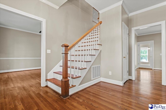 3427 Sussex Ct, Florence, SC 29501 - stairway with wood finished floors and ornamental molding
