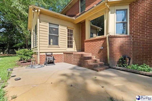 3427 Sussex Ct, Florence, SC 29501 - view of side of property with a patio and brick siding