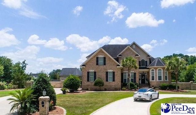 craftsman inspired home with a front yard