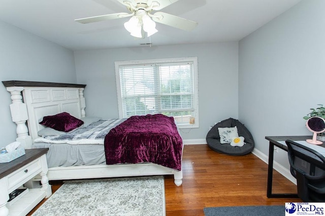 bedroom featuring ceiling fan and dark hardwood / wood-style floors