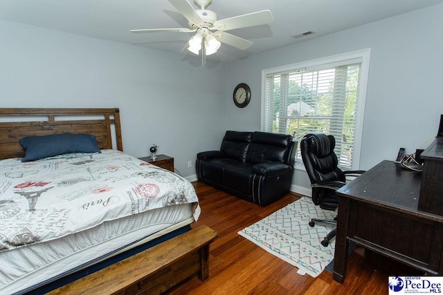 bedroom featuring dark wood-type flooring and ceiling fan