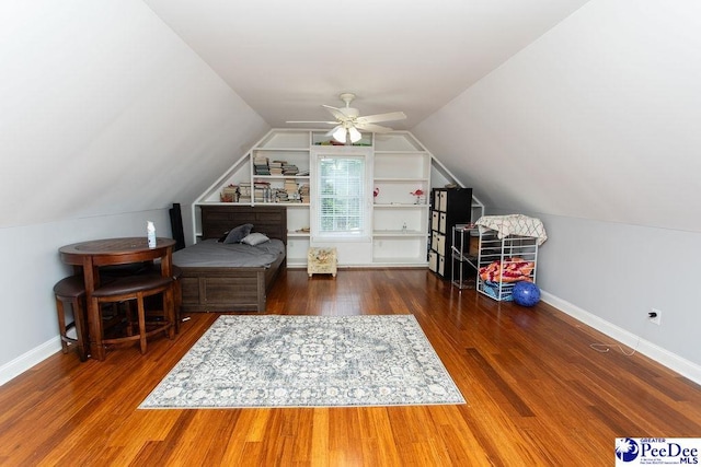 interior space featuring vaulted ceiling, dark hardwood / wood-style floors, and ceiling fan