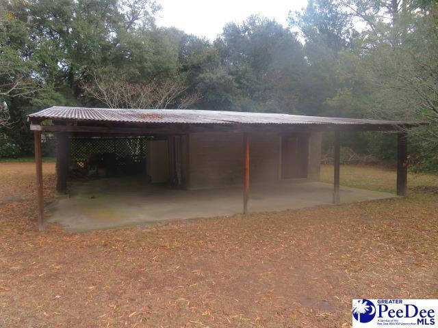 exterior space with a carport