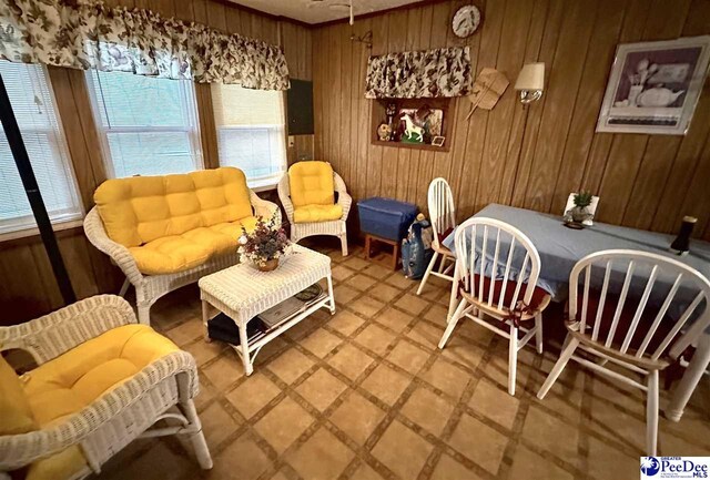 sitting room with wood walls