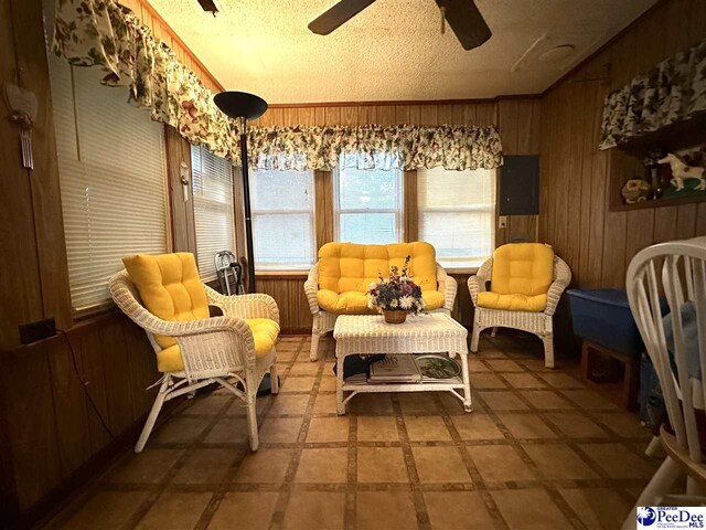 sunroom / solarium with vaulted ceiling and ceiling fan