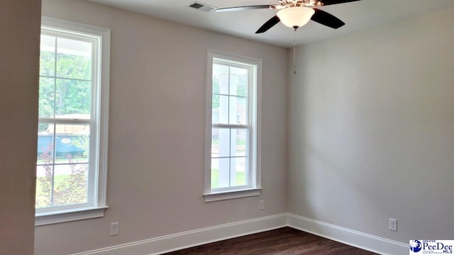 855 Bellemeade Cir, Florence, SC 29501 - empty room with dark wood-style floors and a ceiling fan