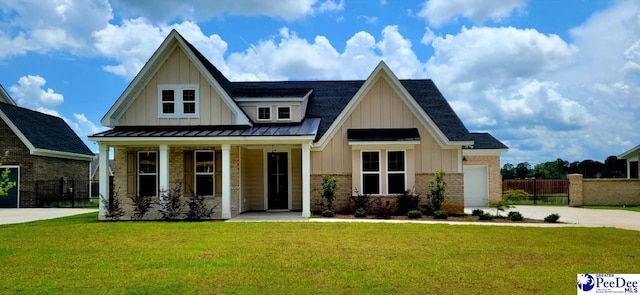 855 Bellemeade Cir, Florence, SC 29501 - view of front of house featuring board and batten siding, a porch, a standing seam roof, and brick siding
