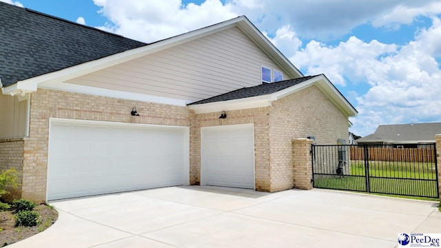 855 Bellemeade Cir, Florence, SC 29501 - view of home's exterior featuring driveway, brick siding, and a garage
