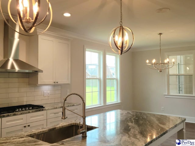 855 Bellemeade Cir, Florence, SC 29501 - kitchen featuring a chandelier, stainless steel gas stovetop, healthy amount of natural light, ornamental molding, and backsplash