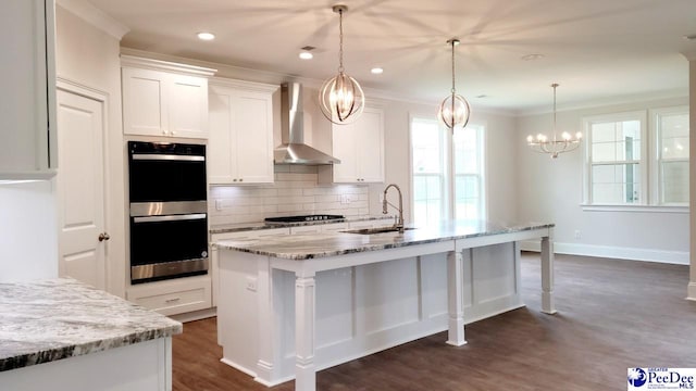 855 Bellemeade Cir, Florence, SC 29501 - kitchen with appliances with stainless steel finishes, wall chimney range hood, healthy amount of natural light, dark wood-style floors, and crown molding